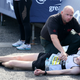 Image for article titled Marathon Runner Collapses A Little Too Early To Be Compassionately Helped Across Finish Line